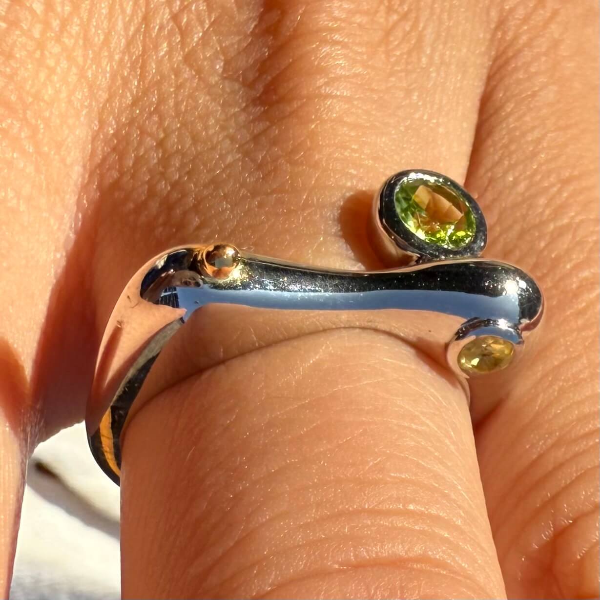 Peridot and citrine mix metal ring with silver band, gold accents, and dual gemstones